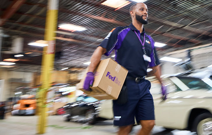 Courier moving a package through a parts warehouse